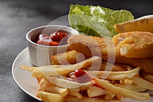 Traditional English Food - Fish and Chips. Fried fish filets and crispy French fries