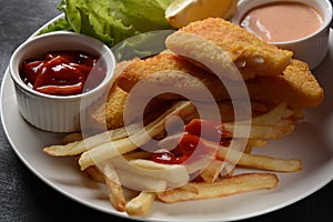 Traditional English Food - Fish and Chips. Fried fish filets and crispy French fries