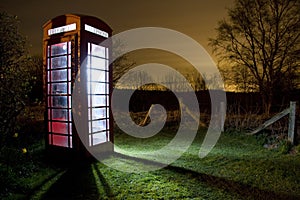 Traditional english phonebox at night