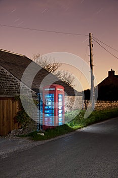 Traditional english phonebox at night