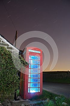 Traditional english phonebox at night