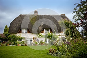 Traditional English thatched country cottage