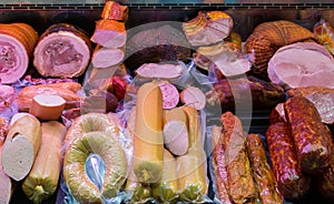 Traditional european sausages and meats in a shop window