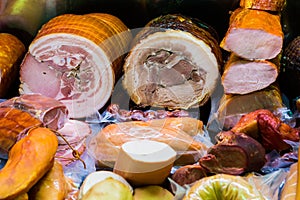 Traditional european sausages and meats in a shop window