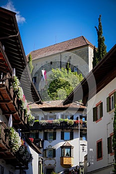 Traditional European town scene in Scena, Italy with old buildings photo