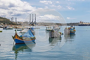 The traditional eyed boats in the harbor of fishing village Marsaxlokk in Malta