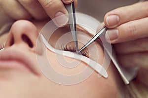 Traditional eyelash extensions. Selective focus. Toned. Makeup close-up.