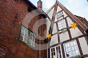 Traditional facade of german half-timbered house. Medieval european architecture. Typical village in Germany.
