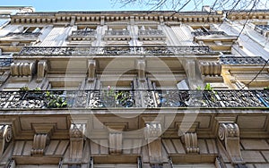 The traditional facade of Parisian building, France.