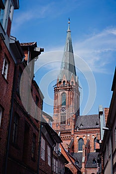 Traditional facades and roofs, Gothic Cathedral church in the historic centre of Luneburg, Germany