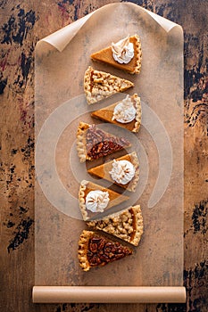 Traditional fall Thanksgiving pie slices, pumpkin and pecan pie