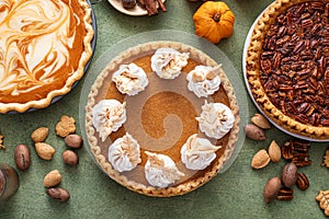 Traditional fall Thanksgiving pies, pumpkin and pecan pie