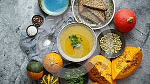 Traditional fall and winter dishes, hot and spicy pumpkin soup with pearsley