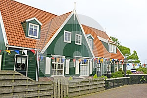 Traditional farmers house decorated with flags at kingsday in th