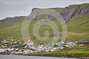 Traditional faroese village in Suduroy island. Fjord landscape. Tvoroyri