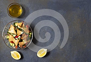 Traditional Fattoush salad  with vegetables and pita bread. Levantine, Arabic, Middle Eastern cuisine