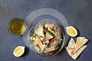 Traditional Fattoush salad  with vegetables and pita bread. Levantine, Arabic, Middle Eastern cuisine