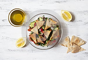 Traditional Fattoush salad  with vegetables and pita bread. Levantine, Arabic, Middle Eastern cuisine
