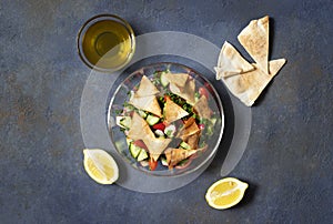 Traditional Fattoush salad  with vegetables and pita bread. Levantine, Arabic, Middle Eastern cuisine