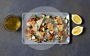 Traditional Fattoush salad  with vegetables and pita bread. Levantine, Arabic, Middle Eastern cuisine