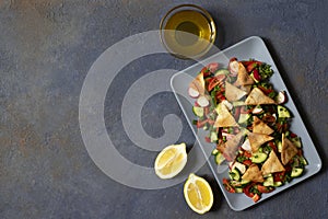 Traditional Fattoush salad  with vegetables and pita bread. Levantine, Arabic, Middle Eastern cuisine