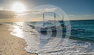 Traditional filipino asian ferry taxi tour boats on puka beach i photo