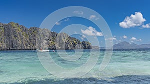 The traditional Filipino double-outrigger dugout bangka boat is anchored