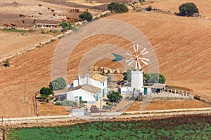 Traditional Finca on Mallorca Majorca farm with windmill landscape scenery aerial view in Spain