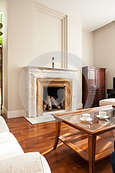 Traditional fireplace in luxury parlour