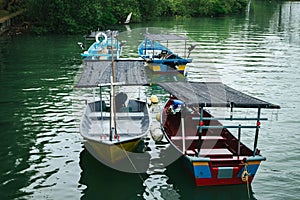 Traditional fisherman boat at Terengganu, Malaysia beach under bright sunny day and blue sky