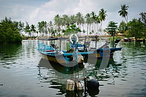 Traditional fisherman boat at Terengganu, Malaysia beach under bright sunny day and blue sky