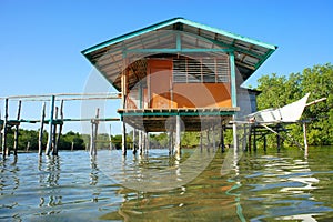 Traditional fisherman's house on stilts in the sea.