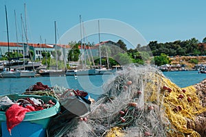 Traditional fishery harbor in greece with multiple colourful fish nests