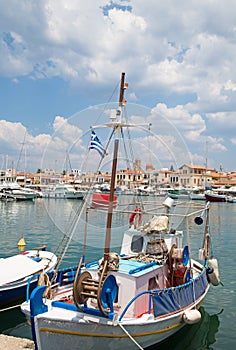 Traditional fishing boat in the port of Aegina in the near of At photo