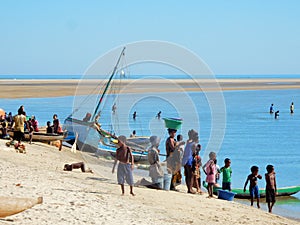 Traditional fishing boats on beach with locals, Madagascar