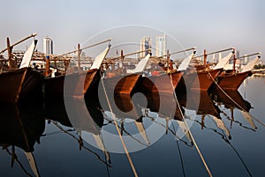 Traditional fishing boats called as dhows in the Fishing harbor of Manama, Bahrain