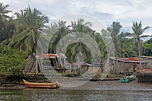 Traditional fishing boats and houses, Cayapas River, Esmeraldas province, Ecuador