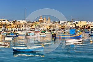 Traditional fishing boats in the Mediterranean Village of Marsaxlokk, Malta