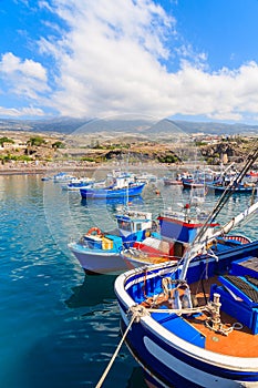 Traditional fishing boats in San Juan port with mountains in background, Tenerife, Canary Islands, Spain