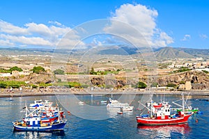 Traditional fishing boats in San Juan port with mountains in background, Tenerife, Canary Islands, Spain