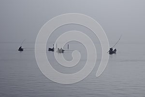 Traditional fishing boats during toil