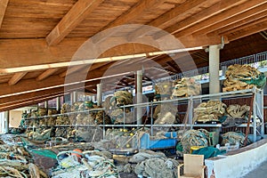 Traditional fishing gear organized in a hangar photo