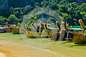 Traditional fishing longtail boats on the tropical beach, Krabi, Thailand