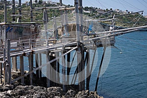 Traditional fishing trabucco on wooden poles in Italy