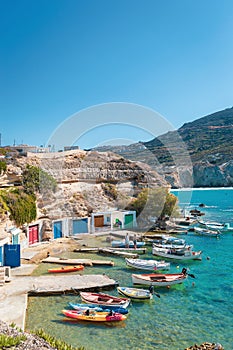 Traditional fishing village of Firopotamos small harbor and fishing boats on Milos Island in Greece