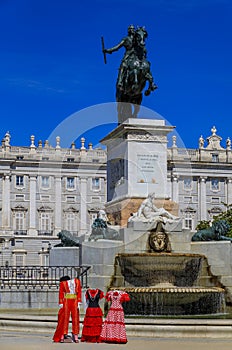 Traditional flamenco and matador costumes photo props at the fountain in Plaza de Oriente Royal Palace in Madrid, Spain