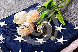 Traditional folded of America United States flag, tag and tulip flower