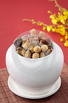 Traditional food of Chinese lunar new year, Buddha jumps over the wall, Chinese Soup Casserole dish, Buddha`s Temptation, named Fo