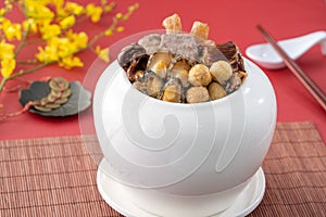 Traditional food of Chinese lunar new year, Buddha jumps over the wall, Chinese Soup Casserole dish, Buddha`s Temptation, named Fo