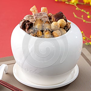 Traditional food of Chinese lunar new year, Buddha jumps over the wall, Chinese Soup Casserole dish, Buddha`s Temptation, named Fo